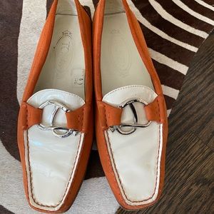 Tod’s orange and white loafers